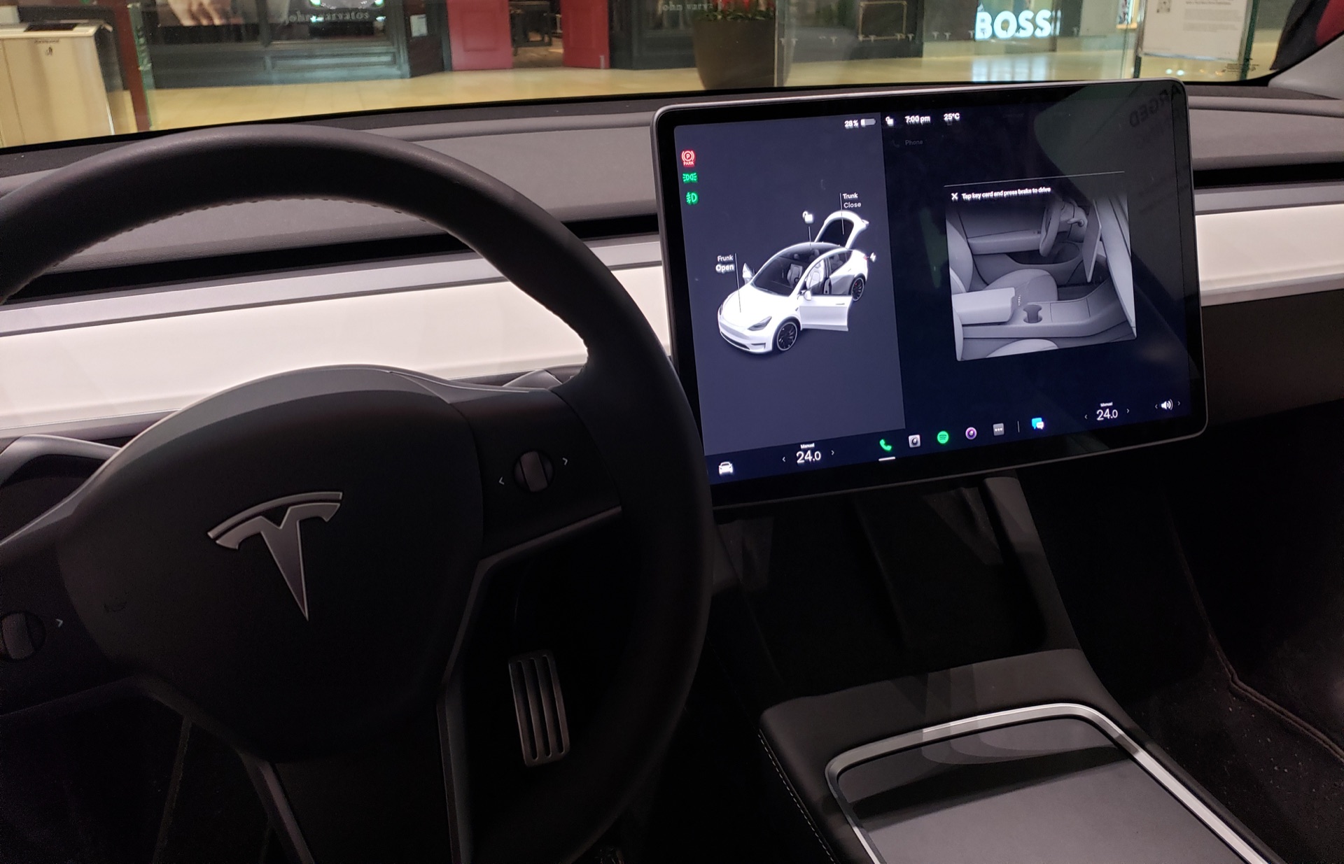 Tesla Model 3 cabin with detailed seats, steering wheel, and dashboard